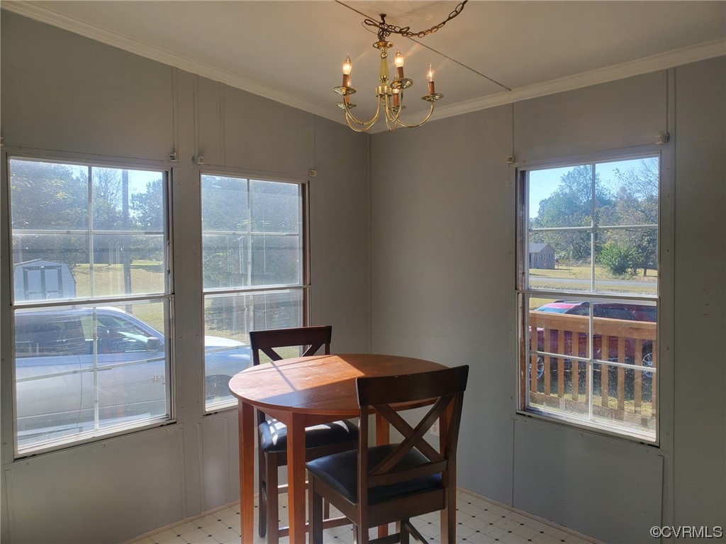 2675 Scuffletown Road Rice, VA 23966 - Photo 4 of 29 a dining room with wooden floor a chandelier a wooden table and chairs