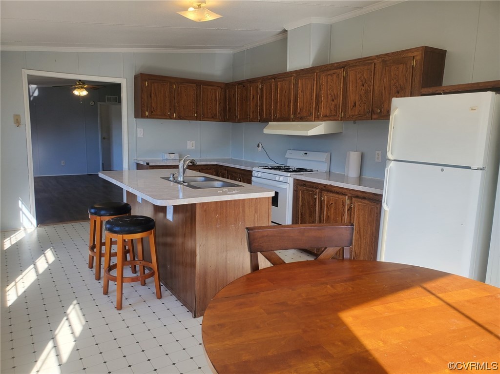 2675 Scuffletown Road Rice, VA 23966 - Photo 5 of 29 a kitchen with a sink a refrigerator and wooden cabinets