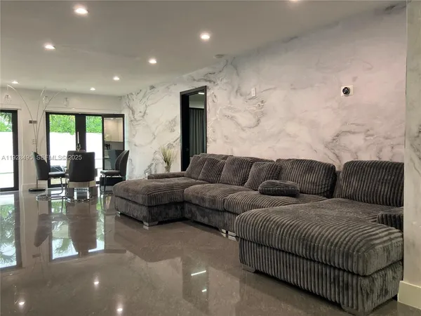 a living room with furniture and a table