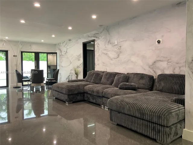 a living room with furniture and a table