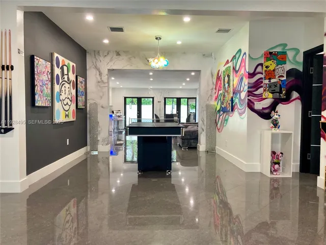 a view of a hallway with a dining area