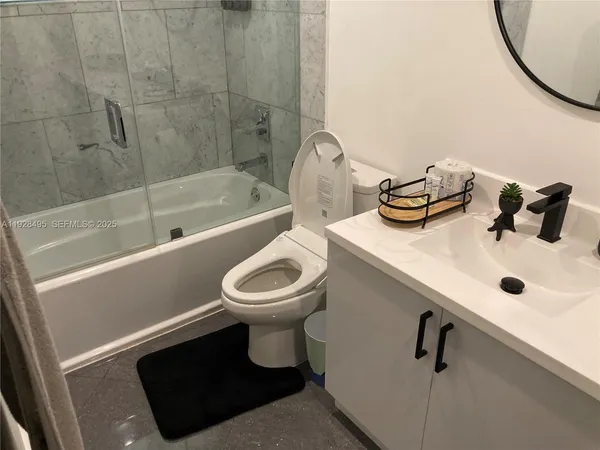 a bathroom with a shower and a toilet