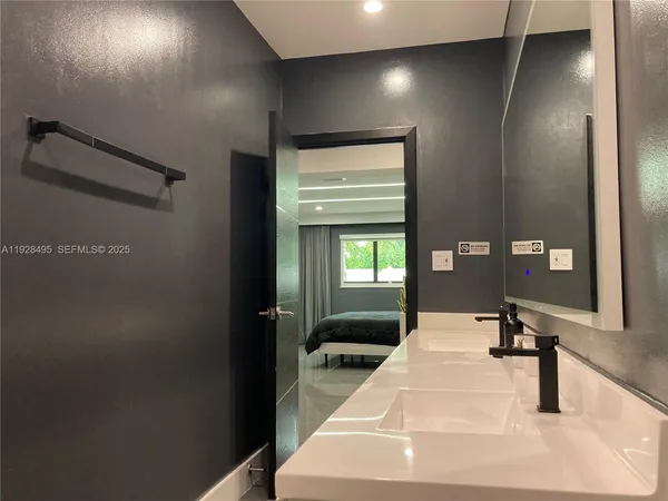 a view of a backyard with furniture and a cabin