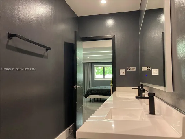 a view of a backyard with furniture and a cabin