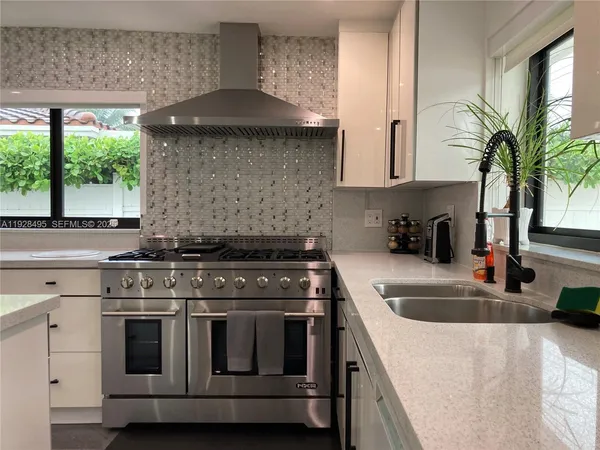 a kitchen with a stove and a sink