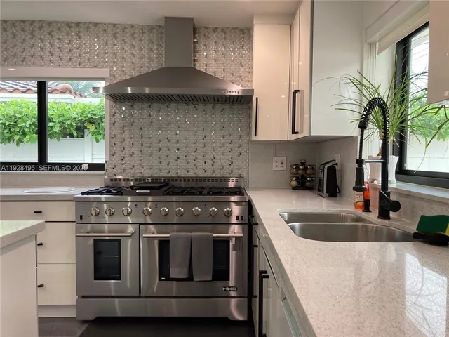 a kitchen with a stove and a sink