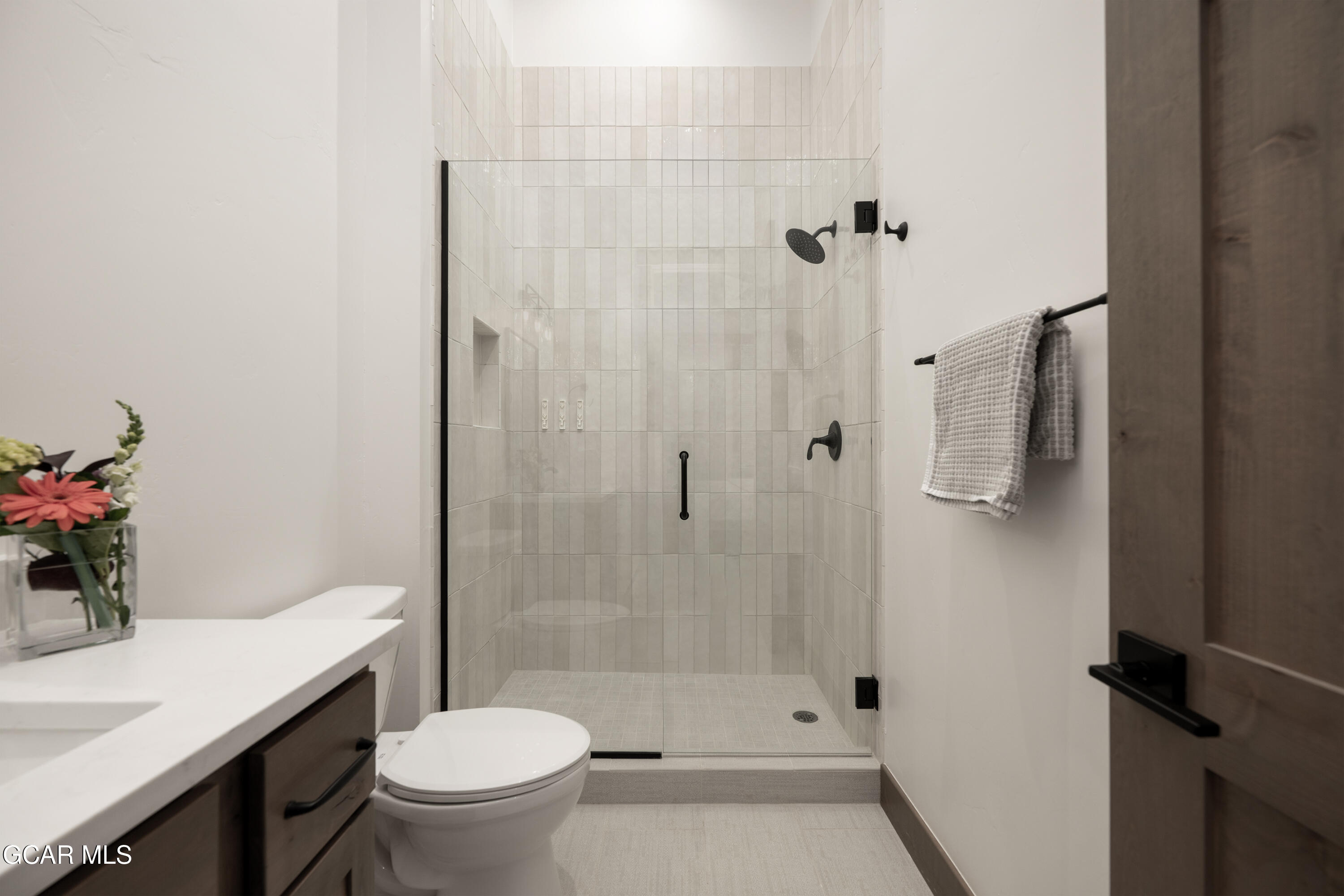 96 Meadow Trail, Unit G304 Fraser, CO 80442 - Photo 19 of 37 a bathroom with a sink toilet and shower