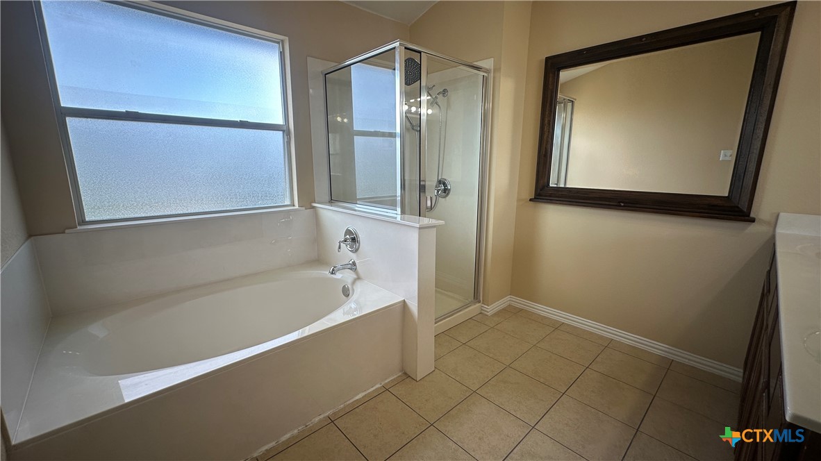 834 Red Fern Drive Harker Heights, TX 76548 - Photo 11 of 16 a bathroom with a bathtub and a shower