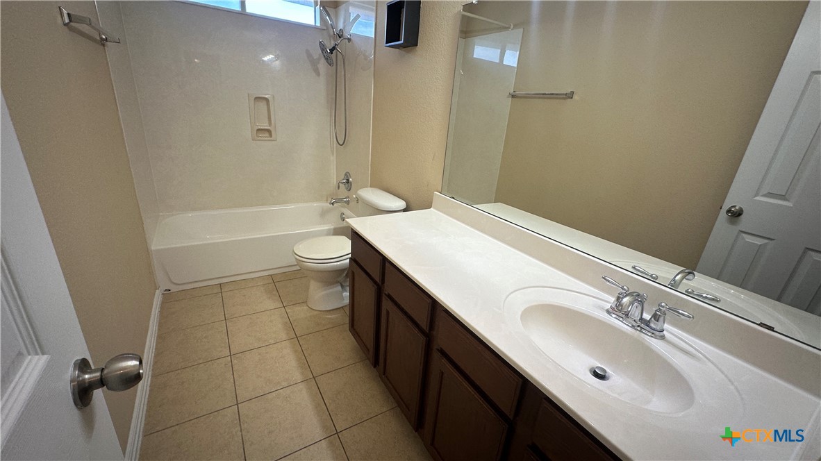 834 Red Fern Drive Harker Heights, TX 76548 - Photo 8 of 16 a bathroom with a granite countertop sink a toilet and shower