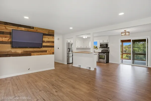 a view of kitchen with wooden floor