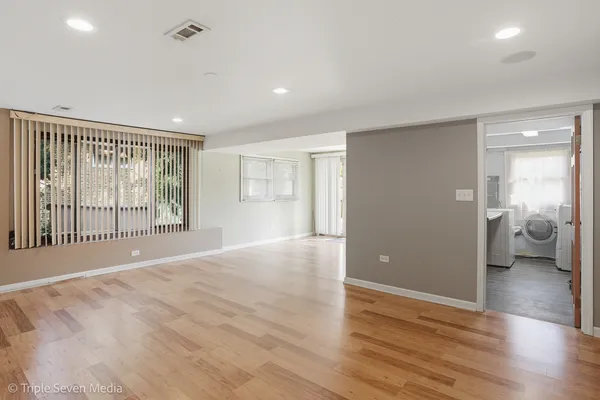 a kitchen with stainless steel appliances granite countertop a stove a refrigerator and a stove