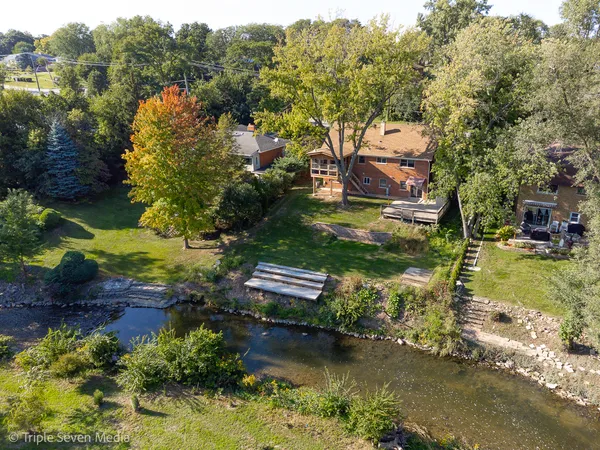 an aerial view of residential houses with outdoor space