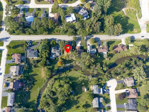 an aerial view of swimming pool yard and outdoor seating
