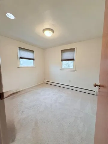 an empty room with a empty space and window