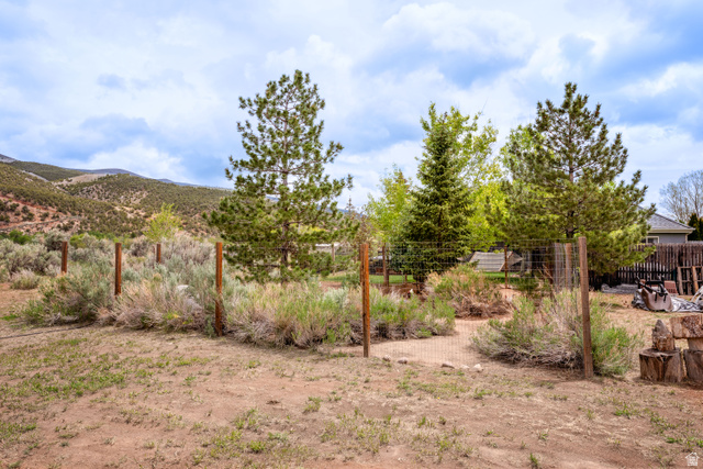 7343 North Sawtooth Cv Road Vernal, UT 84078 - Photo 47 of 64 Fenced outdoor area with established trees and natural foliage