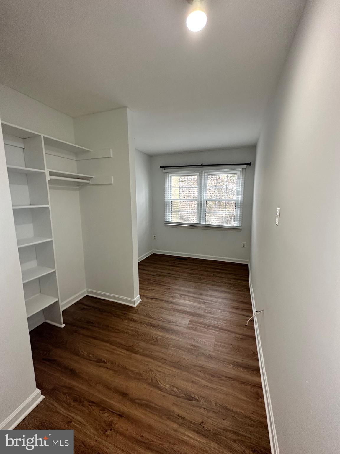 2258 Cartbridge Road Falls Church, VA 22043 - Photo 14 of 35 wooden floor in an empty room with a window