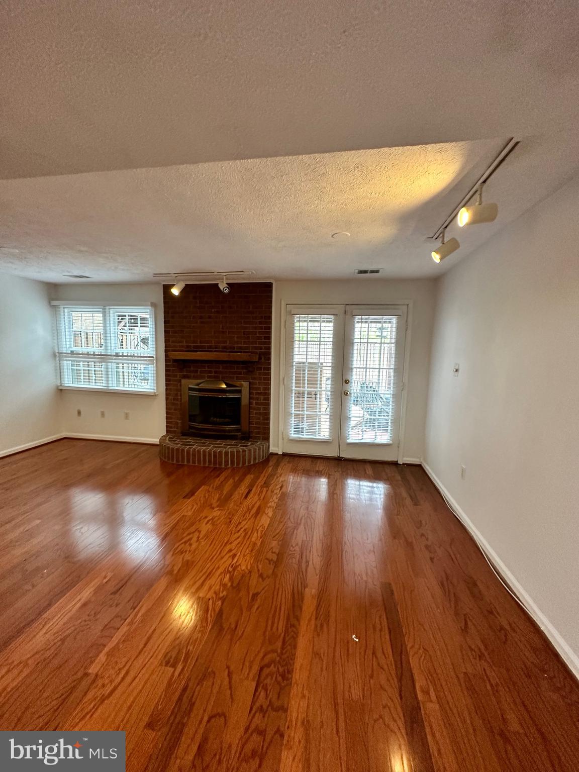 2258 Cartbridge Road Falls Church, VA 22043 - Photo 21 of 35 wooden floor in an empty room with a window
