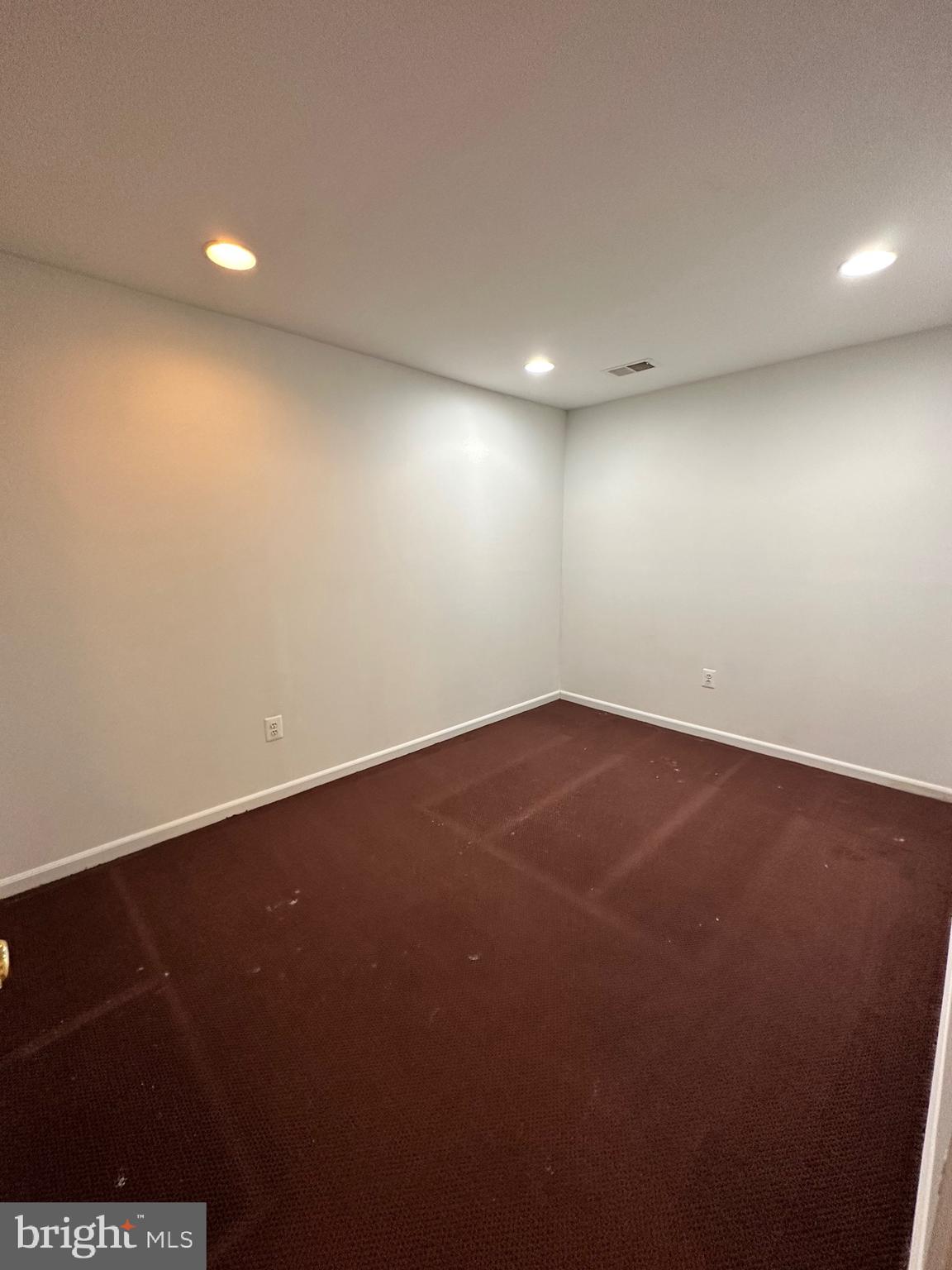 2258 Cartbridge Road Falls Church, VA 22043 - Photo 22 of 35 an empty room with a hard wood floor and a window