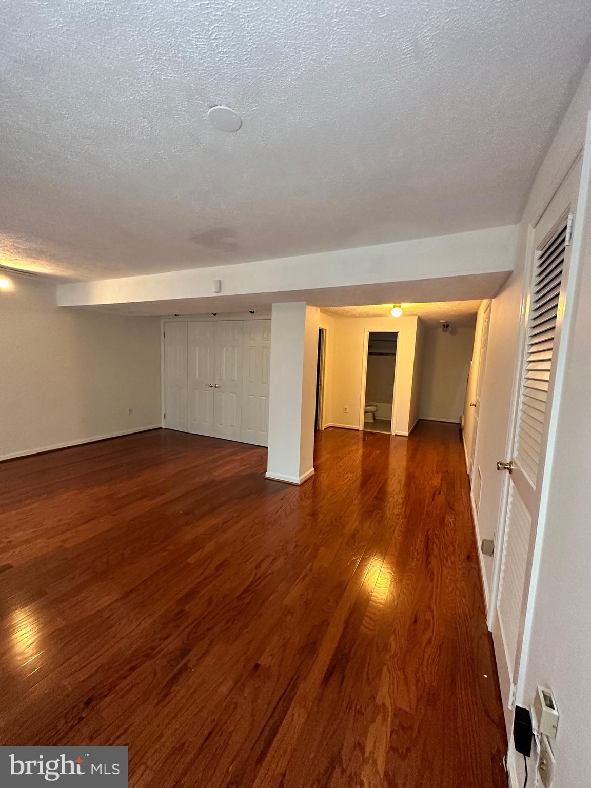 2258 Cartbridge Road Falls Church, VA 22043 - Photo 24 of 35 a view of an empty room with wooden floor and floors