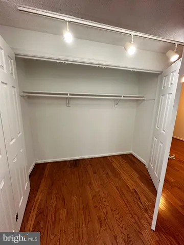 a view of a room with wooden floors and led lights