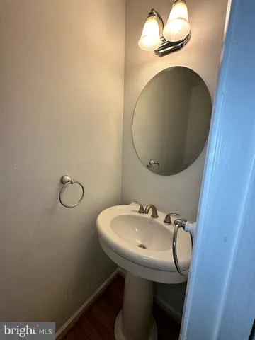 a bathroom with a sink and mirror