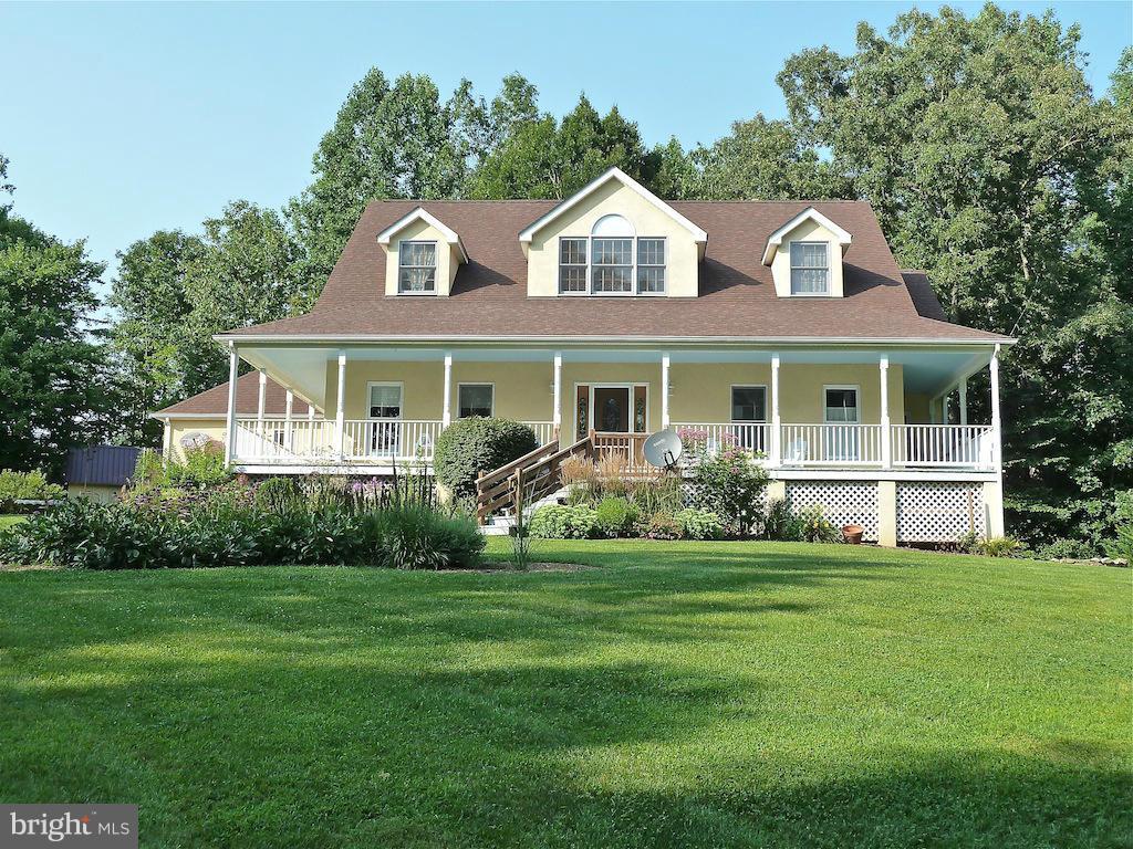 7035 Olinger Road Marshall, VA 20115 - Photo 1 of 25 a front view of a house with a garden