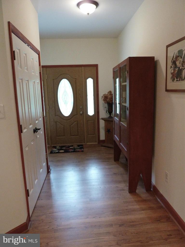 7035 Olinger Road Marshall, VA 20115 - Photo 11 of 25 a view of a livingroom with wooden floor and a window