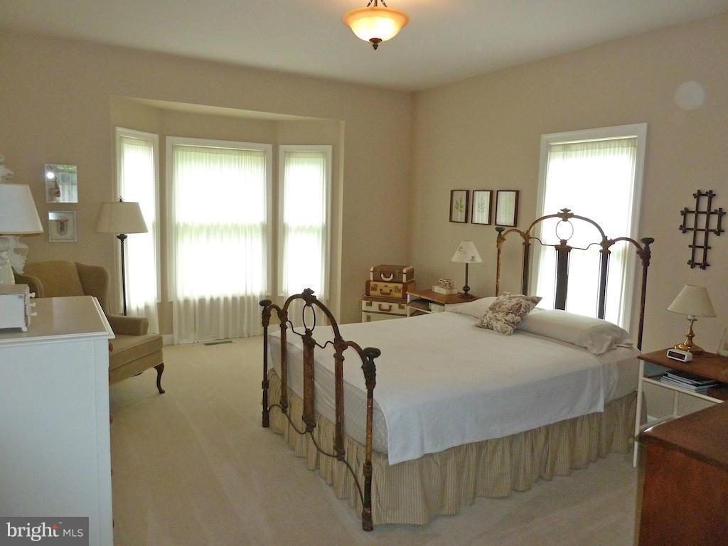 7035 Olinger Road Marshall, VA 20115 - Photo 16 of 25 a bedroom with a bed and a table in it
