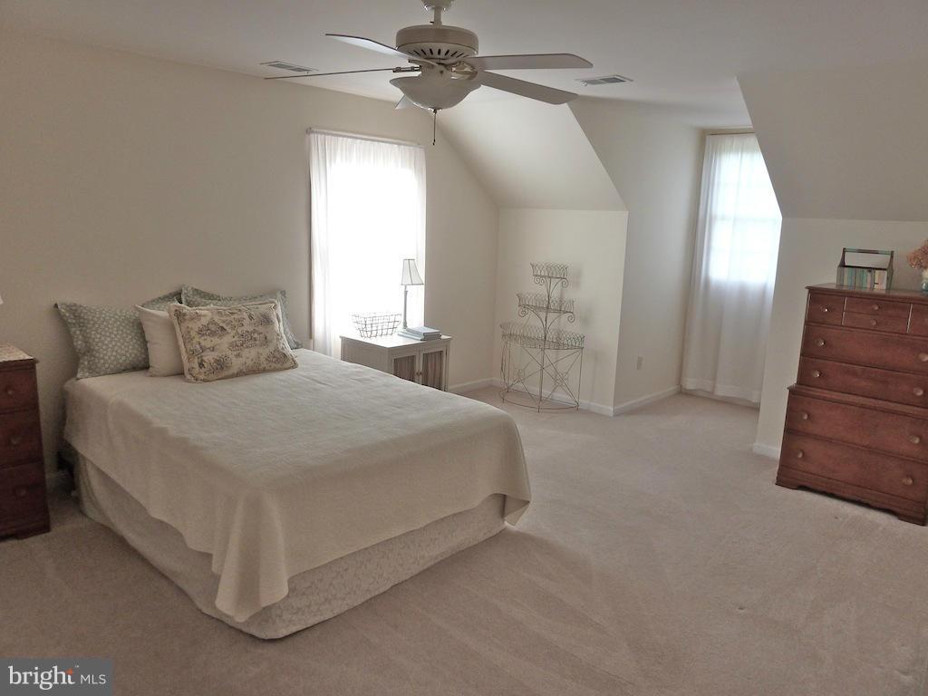7035 Olinger Road Marshall, VA 20115 - Photo 24 of 25 a bedroom with a bed and a chandelier