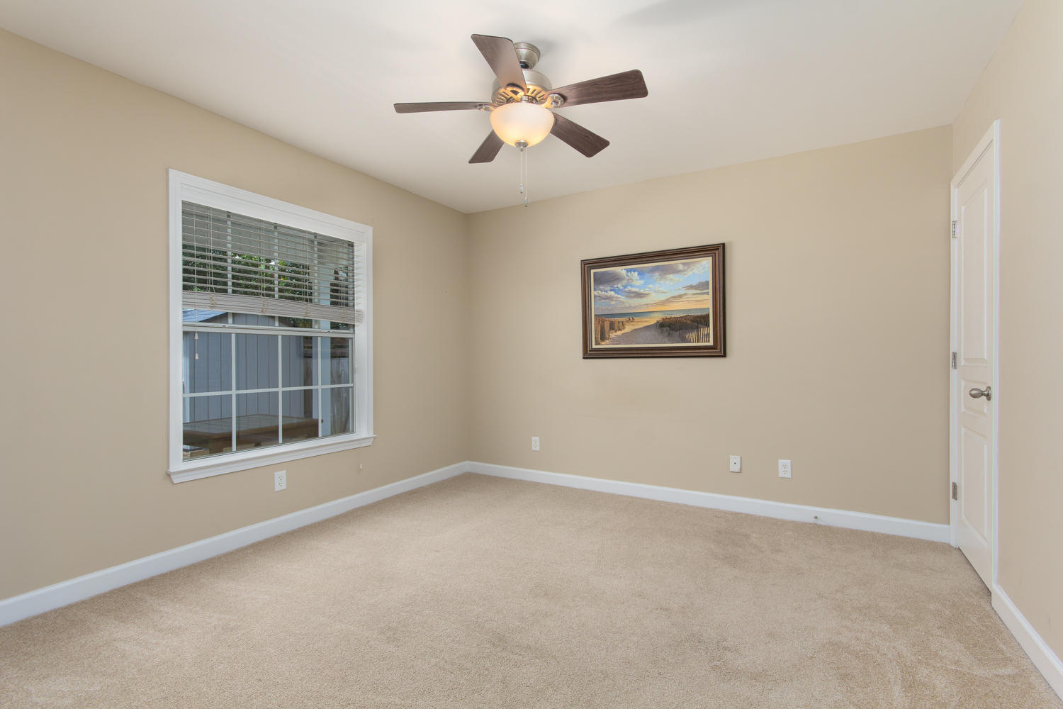 289 South 2nd Street Santa Rosa Beach, FL 32459 - Photo 16 of 22 an empty room with ceiling fan and windows