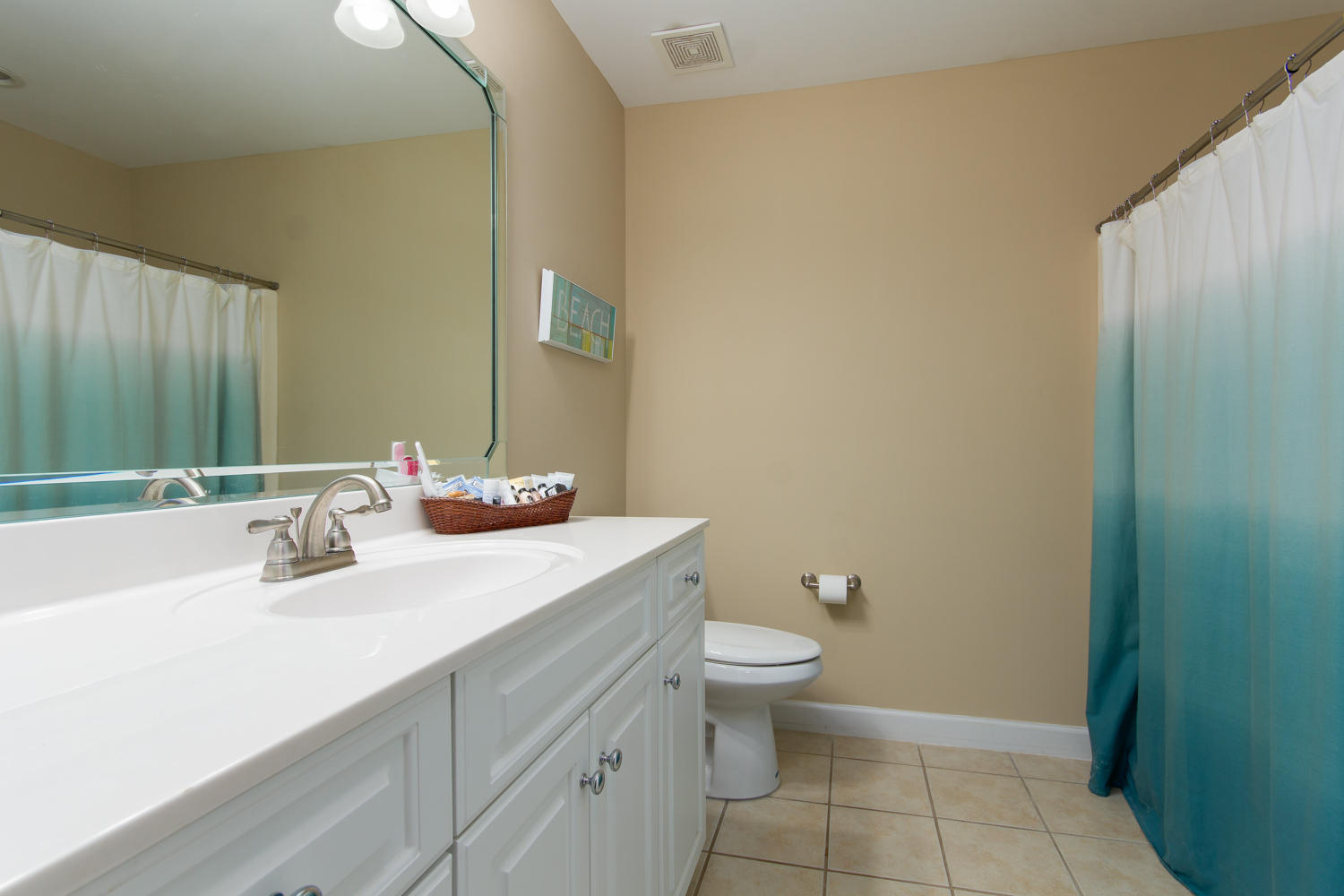 289 South 2nd Street Santa Rosa Beach, FL 32459 - Photo 17 of 22 a bathroom with a granite countertop sink a toilet and a mirror