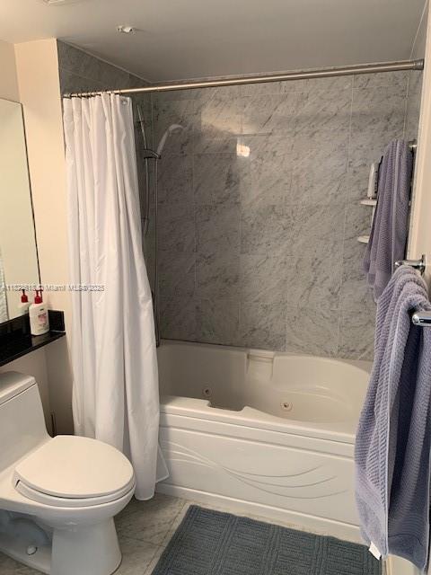 31 Southeast 5th Street, Unit 2601 Miami, FL 33131 - Photo 20 of 41 a bathroom with a shower and a toilet