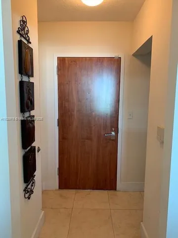 a kitchen with stainless steel appliances granite countertop a refrigerator and a stove