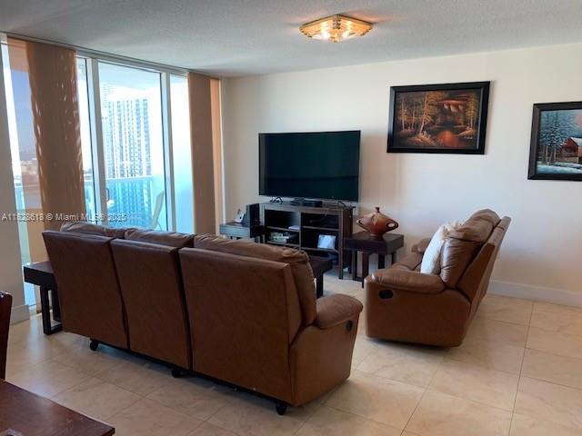 31 Southeast 5th Street, Unit 2601 Miami, FL 33131 - Photo 10 of 41 a living room with furniture and a flat screen tv