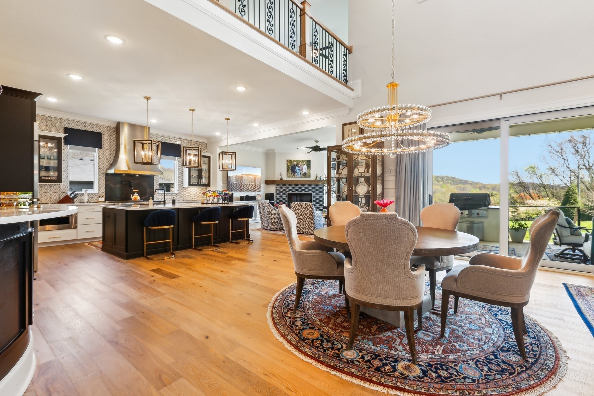 6004 Lookaway Circle Franklin, TN 37067 - Photo 31 of 80 a view of a dining room with furniture a kitchen and chandelier