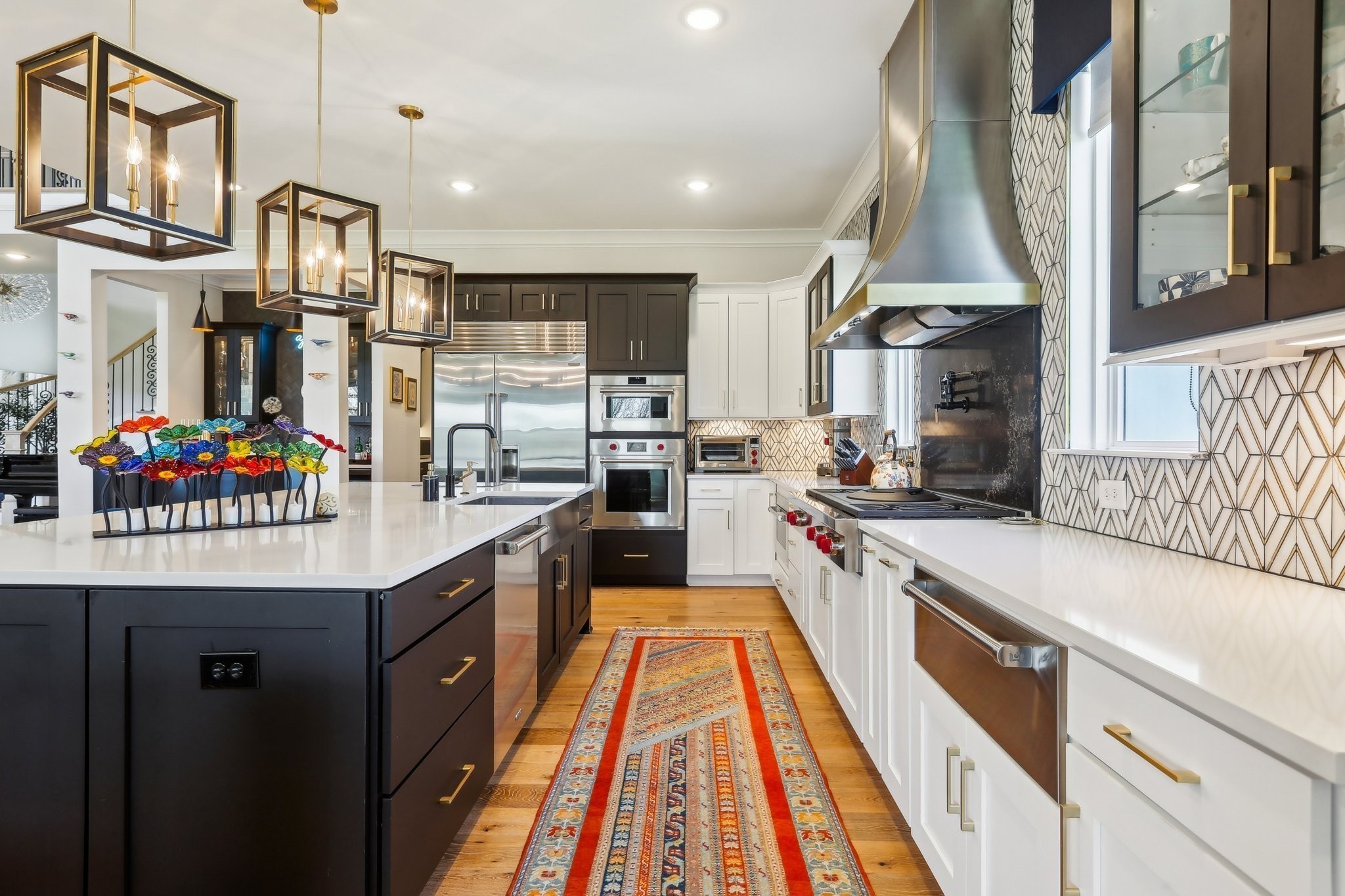 6004 Lookaway Circle Franklin, TN 37067 - Photo 32 of 80 a kitchen with stainless steel appliances granite countertop a sink and a wooden floors