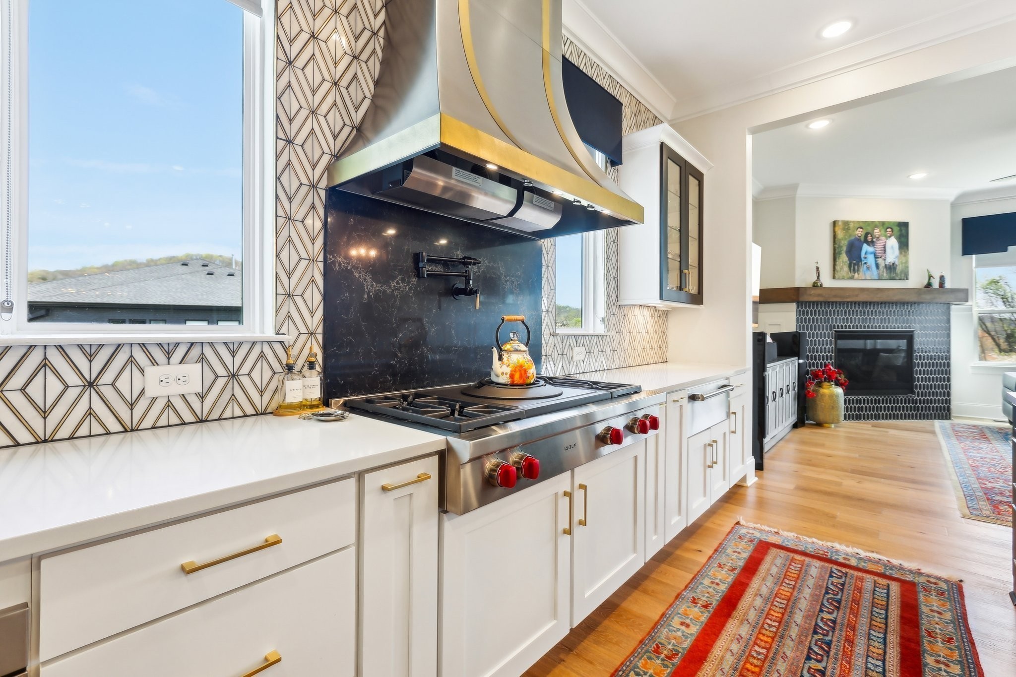 6004 Lookaway Circle Franklin, TN 37067 - Photo 33 of 80 a kitchen with a stove and a wooden floor