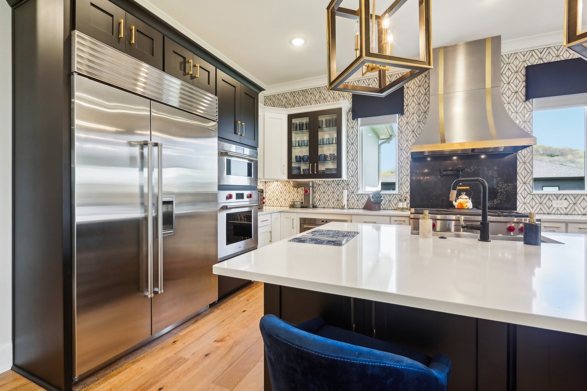 6004 Lookaway Circle Franklin, TN 37067 - Photo 34 of 80 a kitchen with stainless steel appliances a sink stove and refrigerator