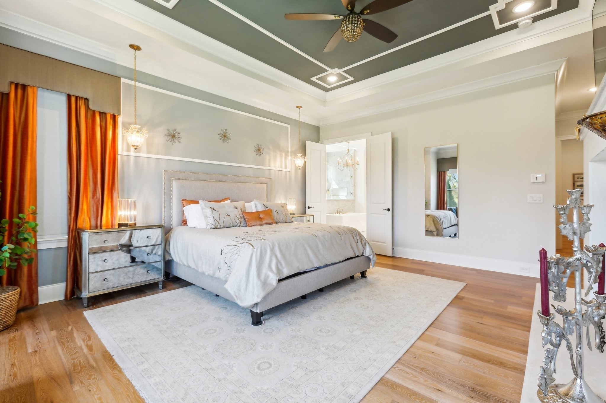 6004 Lookaway Circle Franklin, TN 37067 - Photo 39 of 80 a bedroom with a large bed and a chandelier