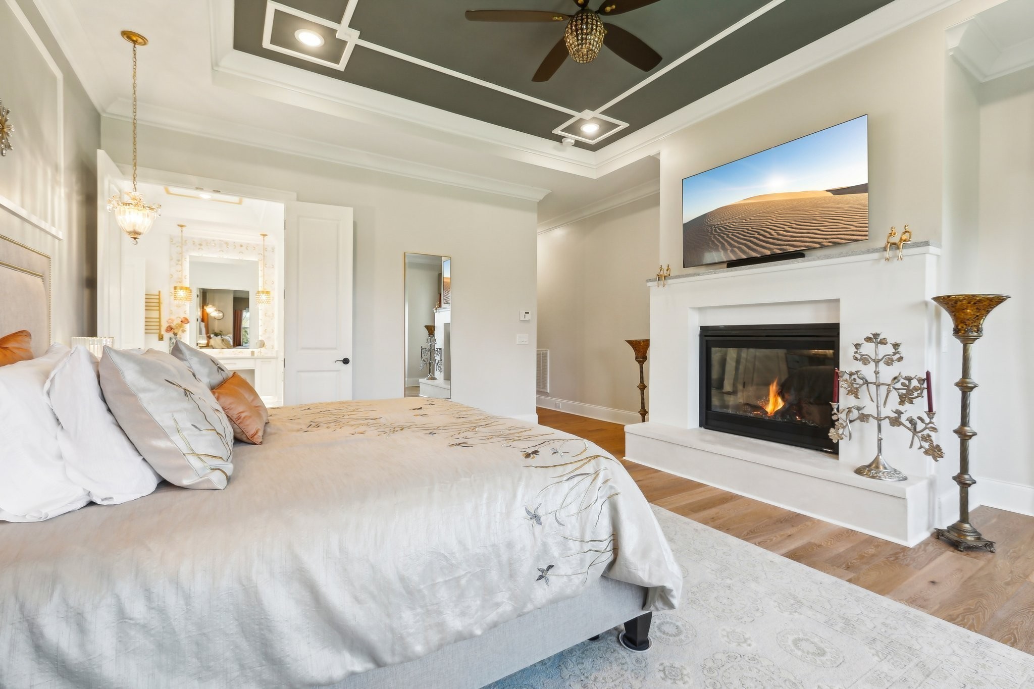 6004 Lookaway Circle Franklin, TN 37067 - Photo 40 of 80 a spacious bedroom with a bed and a fireplace