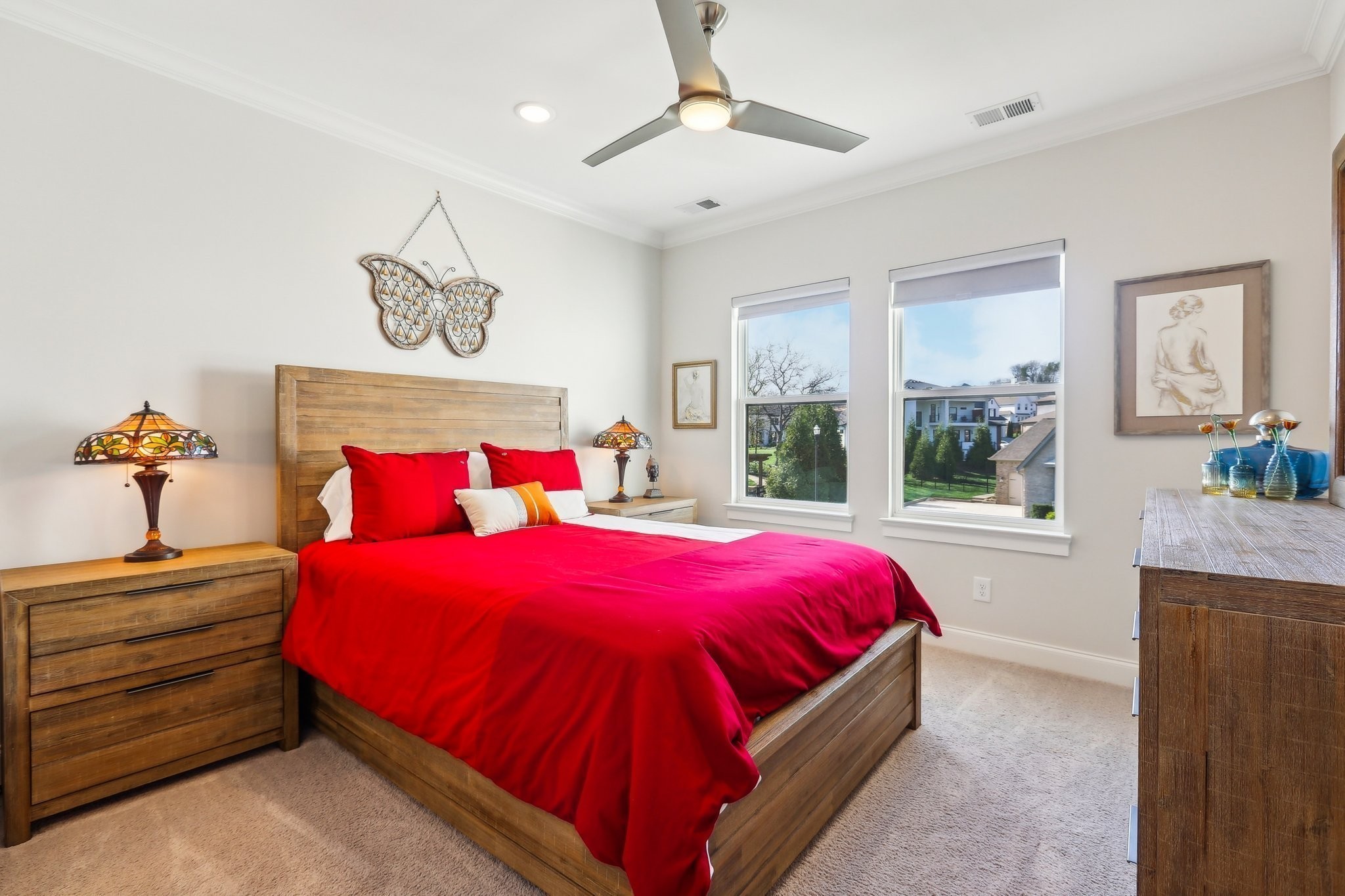 6004 Lookaway Circle Franklin, TN 37067 - Photo 60 of 80 a bedroom with a bed and a chandelier