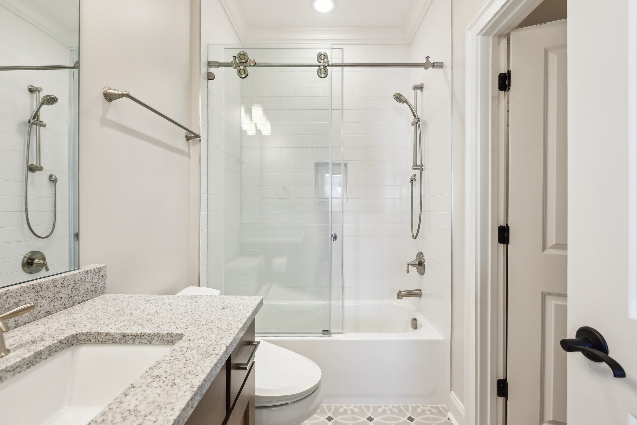6004 Lookaway Circle Franklin, TN 37067 - Photo 61 of 80 a bathroom with a granite countertop bathtub shower sink vanity and toilet