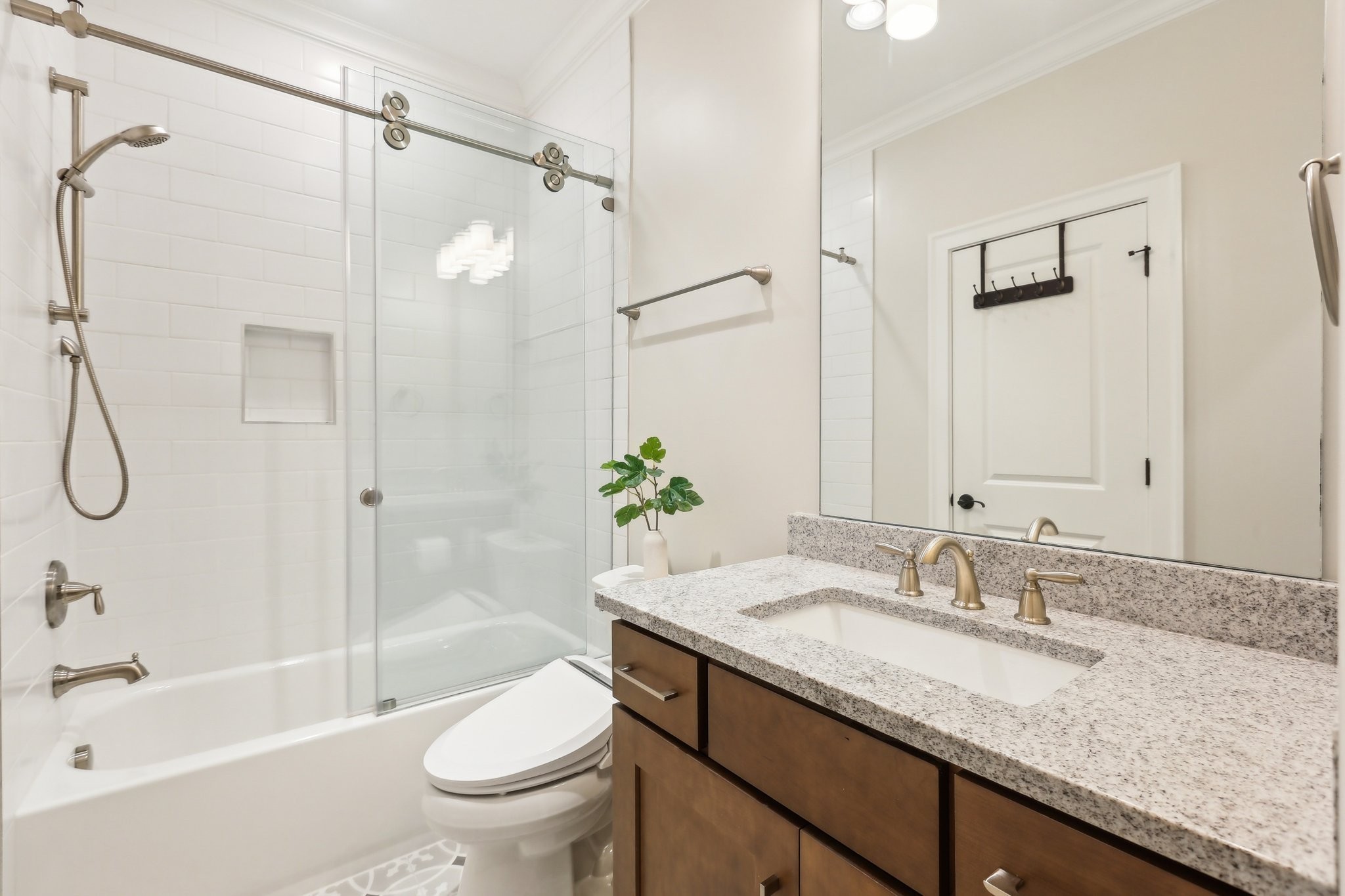 6004 Lookaway Circle Franklin, TN 37067 - Photo 63 of 80 a bathroom with a granite countertop sink a toilet and shower