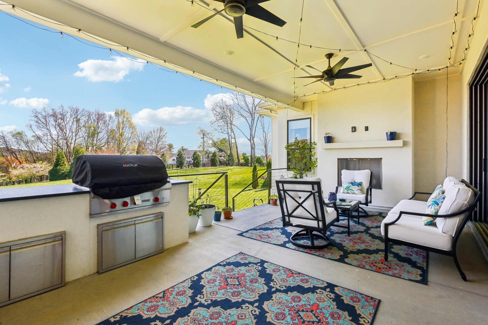 6004 Lookaway Circle Franklin, TN 37067 - Photo 67 of 80 a living room with furniture a rug and a flat screen tv