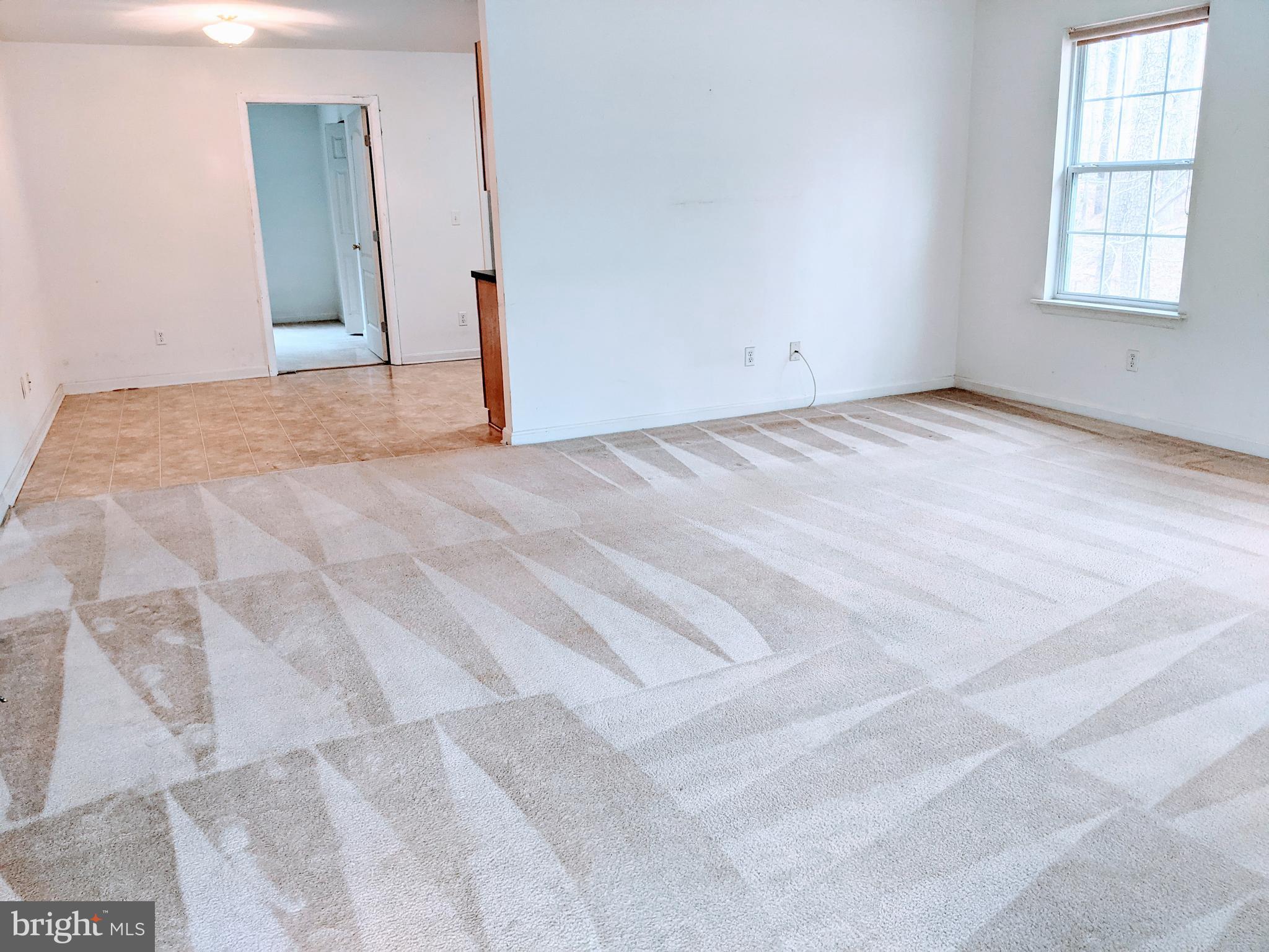 403 Perrys Corner Road Grasonville, MD 21638 - Photo 2 of 10 a view of empty room with window