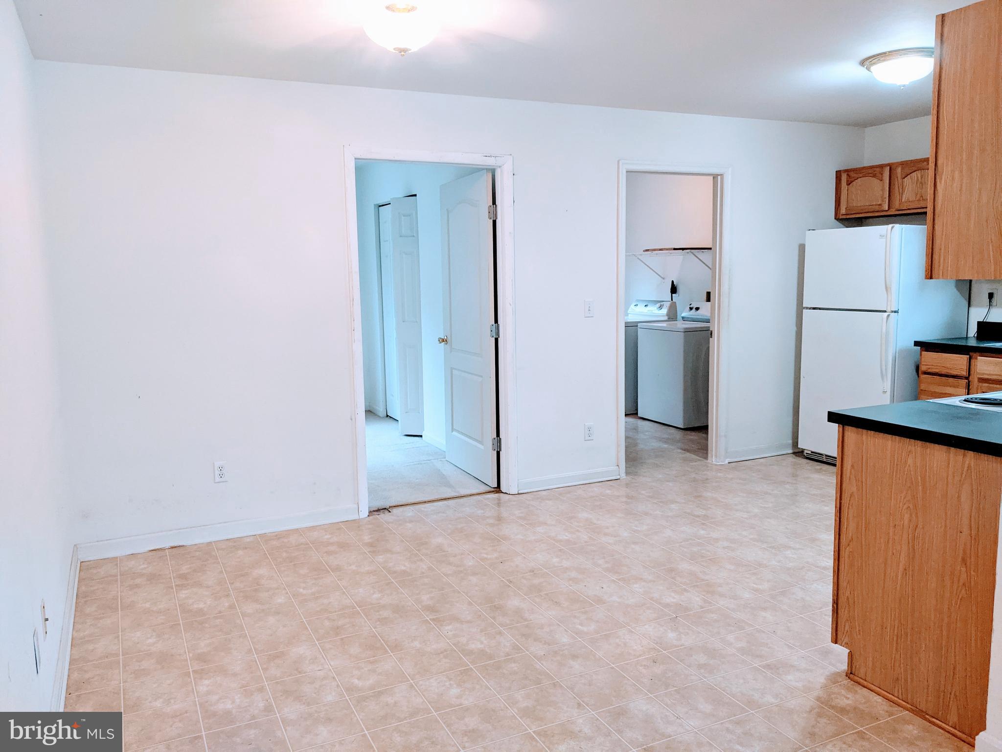 403 Perrys Corner Road Grasonville, MD 21638 - Photo 4 of 10 a view of a kitchen with refrigerator and cabinet