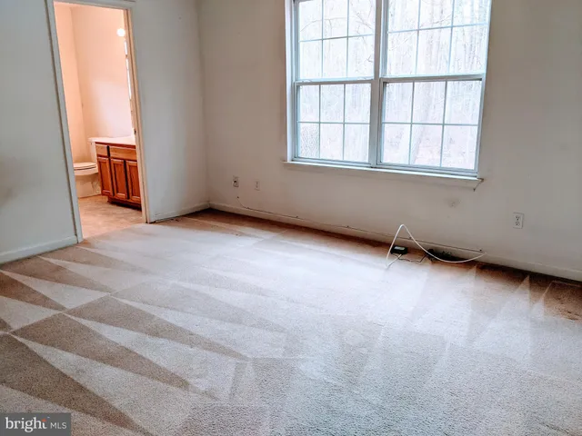 a bathroom with a sink a toilet and a shower