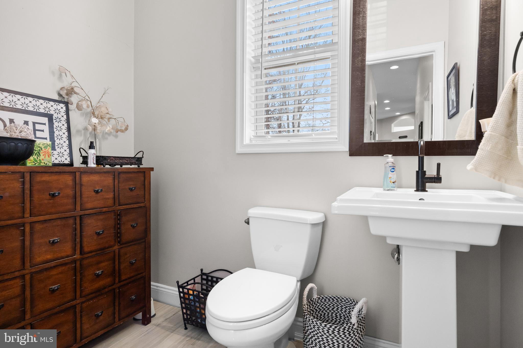 205 Sherwin Road Mullica Hill, NJ 08062 - Photo 26 of 70 a bathroom with a toilet a sink and mirror