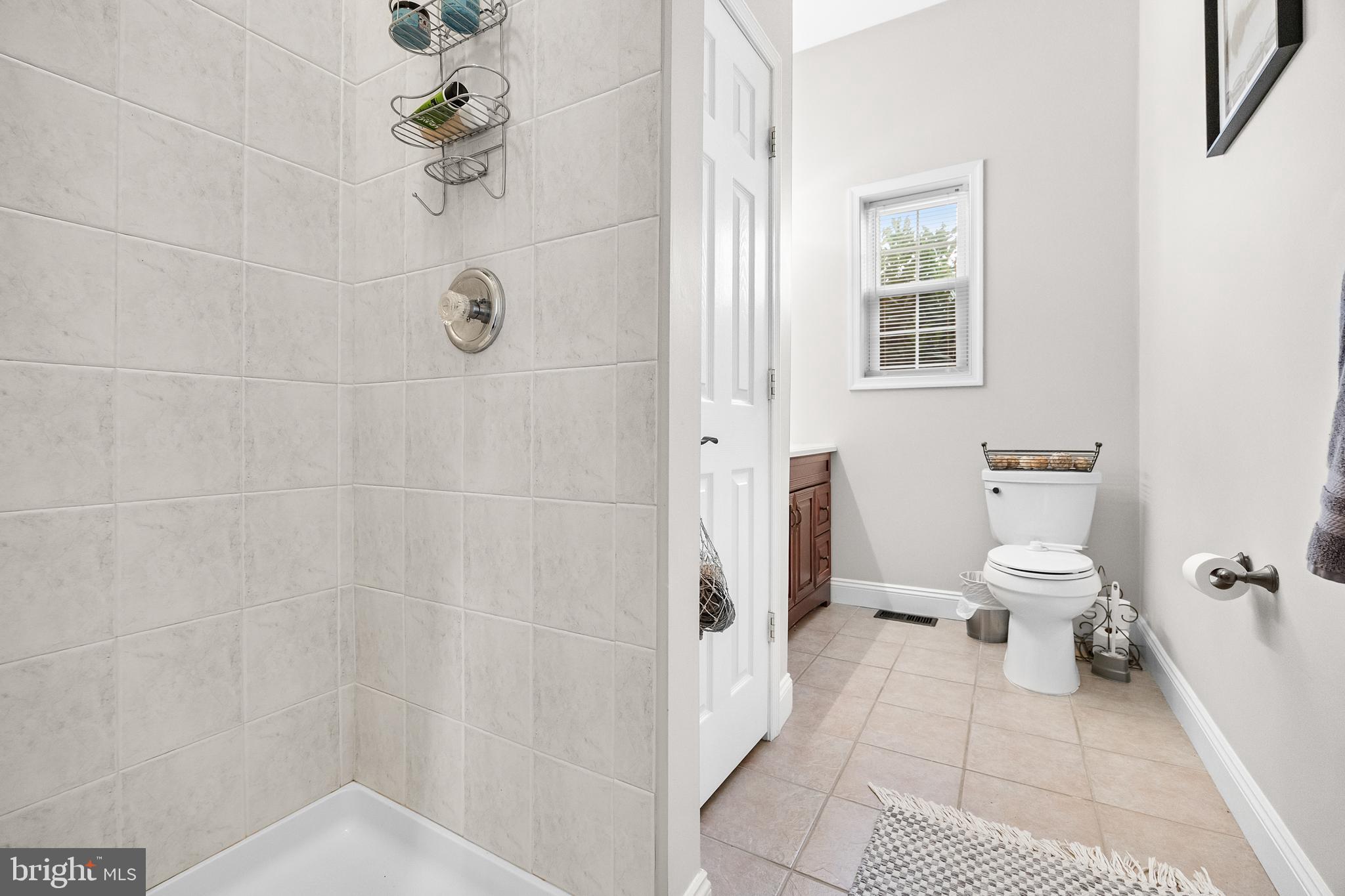 205 Sherwin Road Mullica Hill, NJ 08062 - Photo 28 of 70 a bathroom with a toilet and a shower