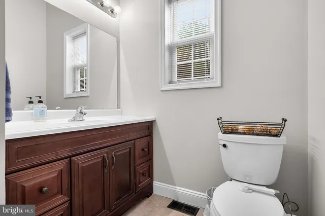 a bath tub sitting in a bathroom next to a window